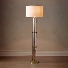 a lamp that is on top of a wooden floor