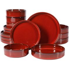 red dinnerware is stacked on top of each other