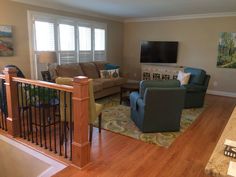 a living room filled with furniture and a flat screen tv