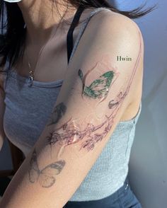 a woman with a flower tattoo on her arm