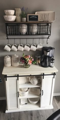 a kitchen counter with plates and cups on it