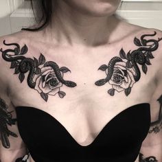 a woman with black tattoos on her chest