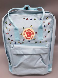 Welcome to my store and choose the perfect hand-embroidered fjallraven kanken backpack   Version & Size + Medium size: 38x27x13cm  + Big size: 42x32x13cm  - Product price includes: hand-embroidered fjallraven kanken backpack and design as shown in the picture - I can make fjallraven kanken backpack hand embroidery patterns according to your ideas - fjallraven kanken backpack will be hand embroidered with thread that won't fade when washed - fjallraven kanken backpack has a small front compartmen Fall Raven Kanken Backpack Embroidery, Fjallraven Kanken Backpack Embroidered, Fjallraven Kanken Mini Bag, Fjallraven Kanken Backpack Big, Fjallraven Kanken Backpack Mini, Stationary Bag, Kanken Classic, Custom Backpack, Cute Embroidery