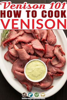 smoked venison backstrap on a white plate with a small bowl of ranch dressing