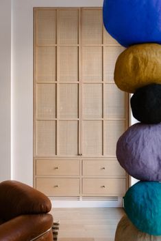 a living room filled with furniture and lots of pillows on top of each other's head