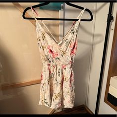 Floral Romper With Crossing And Adjustable Back Straps. No Pockets But Stretchy And Flattering Fit. Never Worn. Size Small Hollister Pants, Floral Romper, Back Strap, Hollister, Pink White, Pant Jumpsuit, Jumpsuit Romper, Pants For Women, Rompers