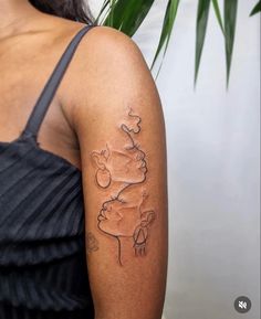 a woman with a tattoo on her arm