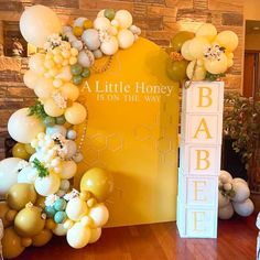 a little honey is on the way balloon arch