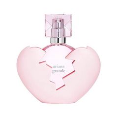 a bottle of perfume in the shape of a heart