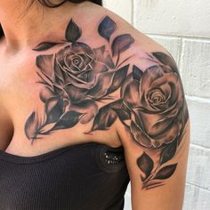 a woman with a rose tattoo on her shoulder