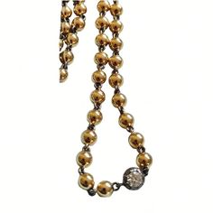 "Lower prices on our main website: https://discomarshmallow.myshopify.com Transport yourself to the opulent allure of the past with our 16-inch Ball Chain Necklace, a masterpiece that pays homage to the elegance of the Georgian and Art Deco periods. This necklace is a true embodiment of vintage charm and contemporary sophistication. At its heart, a brilliant cut 0.25 ct moissanite gleams with a brilliance that rivals the stars. The moissanite is securely nestled within a 14k blackened gold Georgian cut-down collet setting, evoking the intricacies of a bygone era. Enhancing the necklace's allure, the chain itself is a labor of artistry. Handcrafted with precision in 14k yellow gold, its links are adorned with the allure of blackened gold, adding a touch of mystique to the piece. The result Timeless Gold Jewelry With Round Beads, Elegant Formal Necklace With Ball Chain, Elegant Ball Chain Necklace For Formal Occasions, Elegant Formal Ball Chain Necklace, Vintage Gold Diamond Necklace, Vintage Gold Diamond Necklaces, Timeless Gold Single Strand Necklace, Classic Formal Ball Chain Necklace, Elegant White Gold Ball Chain Necklace