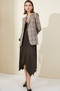 This sophisticated suit boasts a classic brown plaid design, exuding an elegant English style. Made with luxury in mind, it is perfect for those who appreciate timeless fashion and refined taste. The blazer and skirt combination offers style and versatility, making it a must-have for any wardrobe. English style classic brown plaid blazer and skirt suit Peak lapels; front button blazer V-neck, Long sleeves; button cuffs. Structured shoulders. Chest welt pockets. Hip flap pockets Polyester 100% Im Luxury Plaid Blazer With Suit Collar, Luxury Timeless Suits With Welt Pockets, Luxury Long Sleeve Classic Skirt Suit, Luxury Plaid Suits With Long Sleeves, Luxury Plaid Suit With Long Sleeves, Luxury Plaid Blazer For Tailoring, Luxury Brown Blazer With Flap Pockets, Luxury Brown Blazer With Welt Pockets, Luxury Classic Plaid Blazer