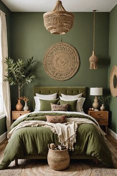 a bed with green sheets and pillows in a bedroom next to two plants on the wall