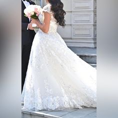 the bride and groom are standing outside together