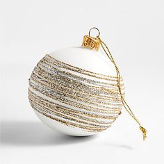 a white ball ornament with gold trim