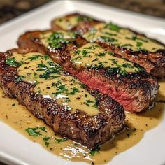 steak with mustard sauce on a white plate