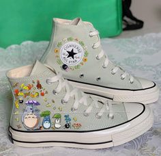 🌿 Love Embroidered Converse 🌿 ❤️ About Our Products: Each pair of shoes from our store is brand new and hand-embroidered to order. Please ensure you select the correct shoe size before checkout. The embroidery is durable and won't fade over time. ✨ Personal Expression: Showcase your unique style with custom embroidery! Contact me to create your own embroidered shoes with a private listing. I'll send you the design for approval before embroidering the shoes. Alternatively, you can design your patterns based on the shoe's plain spaces and send me a photo. 📏 Size & Color: Each listing includes a size and color chart. Follow the instructions to choose the best size for you. The size chart is standard. Note: Refer to the size guide in each listing to choose the appropriate size for your Conv Embroidery Characters, Flowers Shoes, Converse Design, Embroidered Converse, Characters Cartoon, Flower Shoes, Embroidered Shoes, Shoe Art, Photo Size