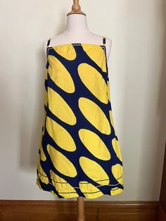 "Vintage 1966 Marimekko Piilo dress, Linssi pattern designed by Kaarina Kellomäki.  Gorgeous and bright vintage 60s Marimekko Linssi patterned mini dress. Iconic pattern in bright yellow and navy blue. Dress is pullover style, a-line shape, perfect for summer!  Made of thick cotton, size 12, but would best fit up to a modern size 10. This dress has had some work done. Previous owner added bric brac along neckline and bottom hem. I also think they may have taken the dress in on the sides and ther Retro Summer Dresses With Bold Print, Retro Bold Print Summer Dress, Yellow A-line Retro Dress, Multicolor Mod Cotton Dresses, Marimekko Fashion, Retro Yellow Cotton Dress, Yellow 60s Dress, Marimekko Sweater, Multicolor Cotton Mod Dress