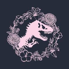 a pink t - shirt with an image of a dinosaur surrounded by flowers