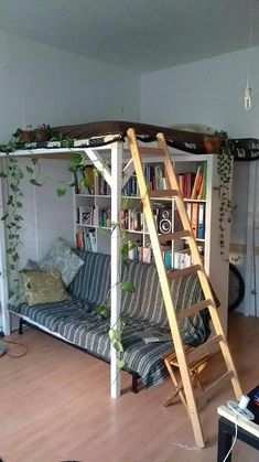 a living room with a bunk bed and bookshelf