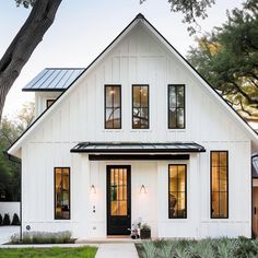 a white house with black trim and windows