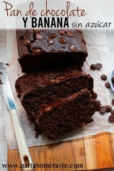 a chocolate cake is cut into slices on a cutting board