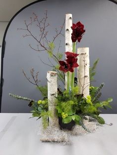 a vase filled with flowers sitting on top of a table