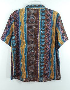 "80's Women's Shirt Short Sleeve Blue Brown Gold Turquoise Cool Geo Abstract Print Button Down Like New Vintage by HILL ARCHER Size XL Super cute fun summer vacation! Button down, black buttons, short sleeve, tiny collar, gather across shoulder, drapy silky light weight fabric, colorful. Blue brown gold pink gold geo colorblock abstract print. Excellent Condition. Easy to wear casual chic vintage for the disco sporting life. MEASUREMENTS: Length - 27\" Bust (underarms to underarms) - 23\"x 2 Sle Blue Collared Bohemian Tops, Retro Blue Camp Shirt With Vintage Print, Retro Buttoned Tops For Beach, Retro Beach Tops With Buttons, Retro Blue Button-up Hawaiian Shirt, Retro Blue Collared Hawaiian Shirt, Blue Retro Hawaiian Button-up Shirt, Vintage Button-up Beach Top, Blue Retro Tops With Buttons