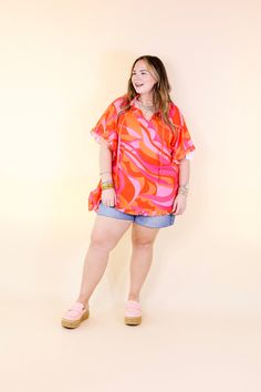 Introducing our vibrant 'Fun and Free' top, a must-have for your wardrobe! Designed with a playful orange and pink palette, this flowy top exudes charm with its ruffled sleeves and trendy tie neckline. Ideal for any occasion, its half-sleeve length ensures comfort while maintaining your stylish flair. Elevate your look effortlessly and embrace a carefree vibe with this versatile piece. Model: Abby is wearing a size M/L. Maci is wearing a size 1XL/2XL. Nancy is wearing a size 1XL/2XL. Size Sugges Pink Palette, Giddy Up Glamour, Flowy Top, Pink Design, Ruffled Sleeves, Flowy Tops, Shine Bright, Half Sleeve, Ruffle Trim