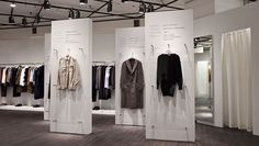 an open room with clothes on display in it