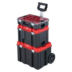 three black and red plastic boxes stacked on top of each other with one cart attached to it