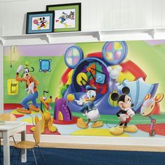 mickey mouse wall mural in a children's room