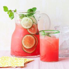 a pitcher and two glasses filled with watermelon