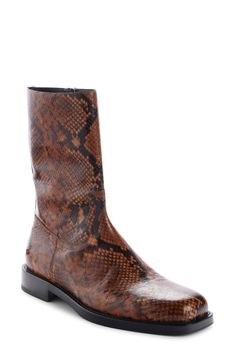 A square toe refines the silhouette of a handsome boot that's topped with snakeskin-printed leather. 1" heel, 25mm (size 42MI) 9 1/2" shaft, 12" circumference (size 42MI) Made in Italy Side zip closure Leather upper and lining/rubber sole Designer Shoes Snake Print Boots With Medium Width And Almond Toe, Snake Print Boots With Almond Toe And Medium Width, Elegant Leather Snake Print Boots, Luxury Leather Boots With Snake Print, Fitted Leather Boots With Snake Print, Fitted Leather Snake Print Boots, Snake Print Boots With Almond Toe, Snake Skin Boots, Boot Print