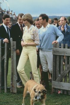 queen elizabeth and prince edward with their dog at the polo match in england on july 29,