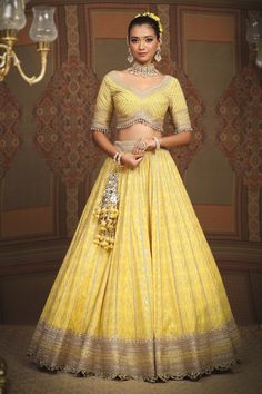 Lemon yellow cotton shimmer chanderi lehenga with attached cancan, geometric patterns, intricate gota, dori and badla work and broad border. Comes with padded, gota work blouse and lace border net dupatta. - Aza Fashions Badla Work, Chanderi Lehenga, Lehenga Pattern, Yellow Lehenga, Gota Work, Lehenga Blouse, Net Dupatta, Lace Border, Beaded Tassels