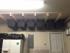 there are many storage bins on the wall