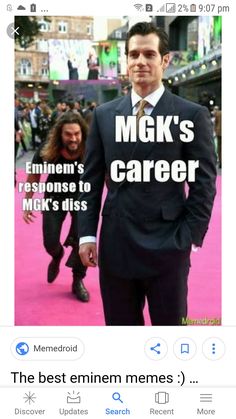 a man in a suit and tie standing on a pink carpet with the words mck's career