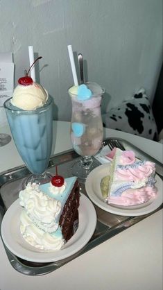 two desserts on plates with drinks in the background