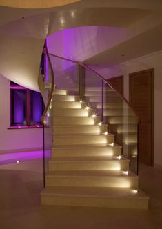 the stairs are lit up with purple lights