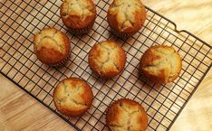 six muffins cooling on a wire rack