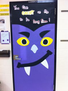 a door decorated with an image of a purple monster