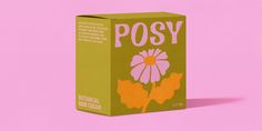 a carton of posy tea on a pink background