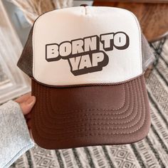 Embrace your chatty side with this stylish and fun trucker hat. Featuring the playful phrase, "Born to Yap," this hat is perfect for those who love to keep the conversation going and share their thoughts with the world. Whether you're out with friends or just running errands, this hat is sure to be a fun addition to your wardrobe. ♥ Stay cool and stylish with our classic 5-Panel High Crown Mesh Back Trucker Hat. ♥ The breathable mesh back ensures comfort, while the seamless foam front panel prov Brown Trucker Hat With Letter Print, Retro 5-panel Hat With Letter Print, Brown Trucker Baseball Cap With Letter Print, Brown Trucker Hat With Letter Print And Flat Brim, Retro Brown Trucker Hat With Letter Print, Brown Letter Print Hat, One Size Fits Most, Brown Letter Print Hat, Trucker Hat With Letter Print, 5-panel, Trucker Hat With Letter Print And 5-panel Shape