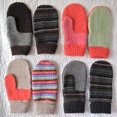 six pairs of mittens laid out on top of a white sheet with the same color and pattern