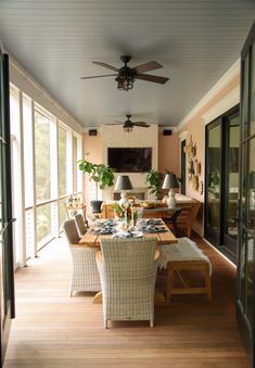 the dining room table is set with place settings