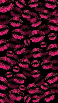 pink lipstick kisses on black background