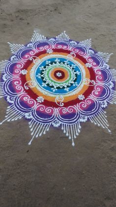 a colorful circular design painted on the ground