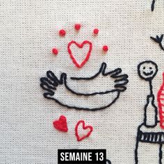 the embroidery pattern shows two people holding hands and one is holding a bottle with hearts on it