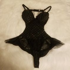 Black Sparkle Teddy With Black Satin Bows Has Mesh Lace Trim Made Of 90% Nylon 10% Spandex Black Bodysuit With Built-in Bra For Club, Nylon Underwire Bodysuit For Party, Black Lined Dancewear Bodysuit, Dancewear Bodysuit With Lined Body For Party, Black Nylon Bodysuit For Evening, Black Dancewear Bodysuit With Lined Body, Black Underwire Nylon Bodysuit, Black Underwire Bodysuit For Party, Black Nylon Bodysuit For Night Out